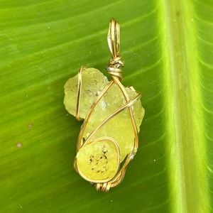 Gold wrapped brucite pendant